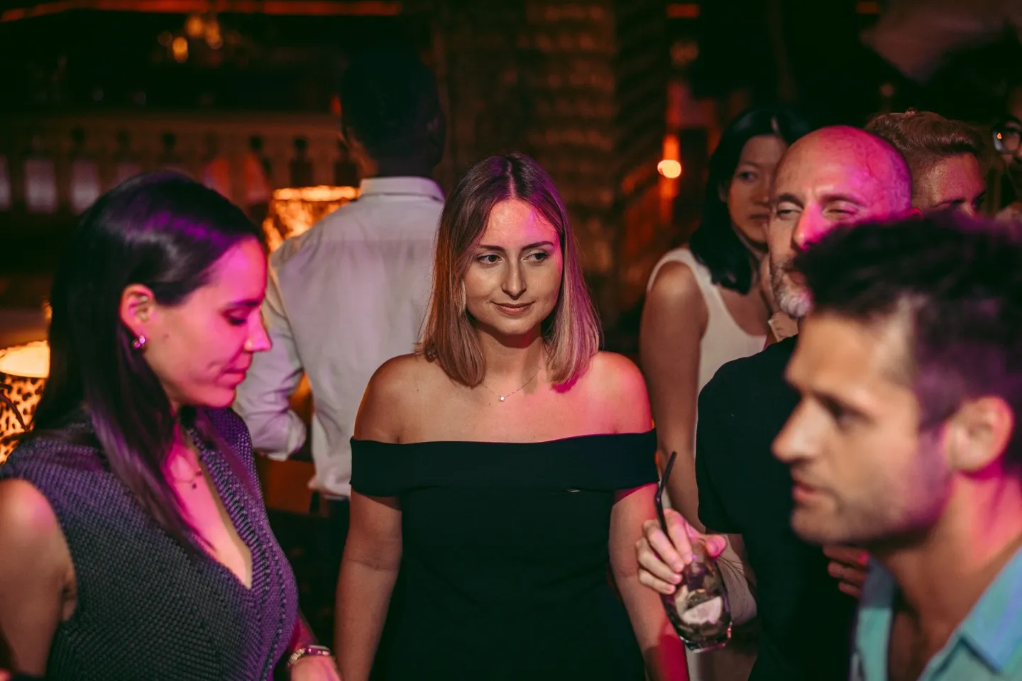Guests talking at the bar at The Club Agadir