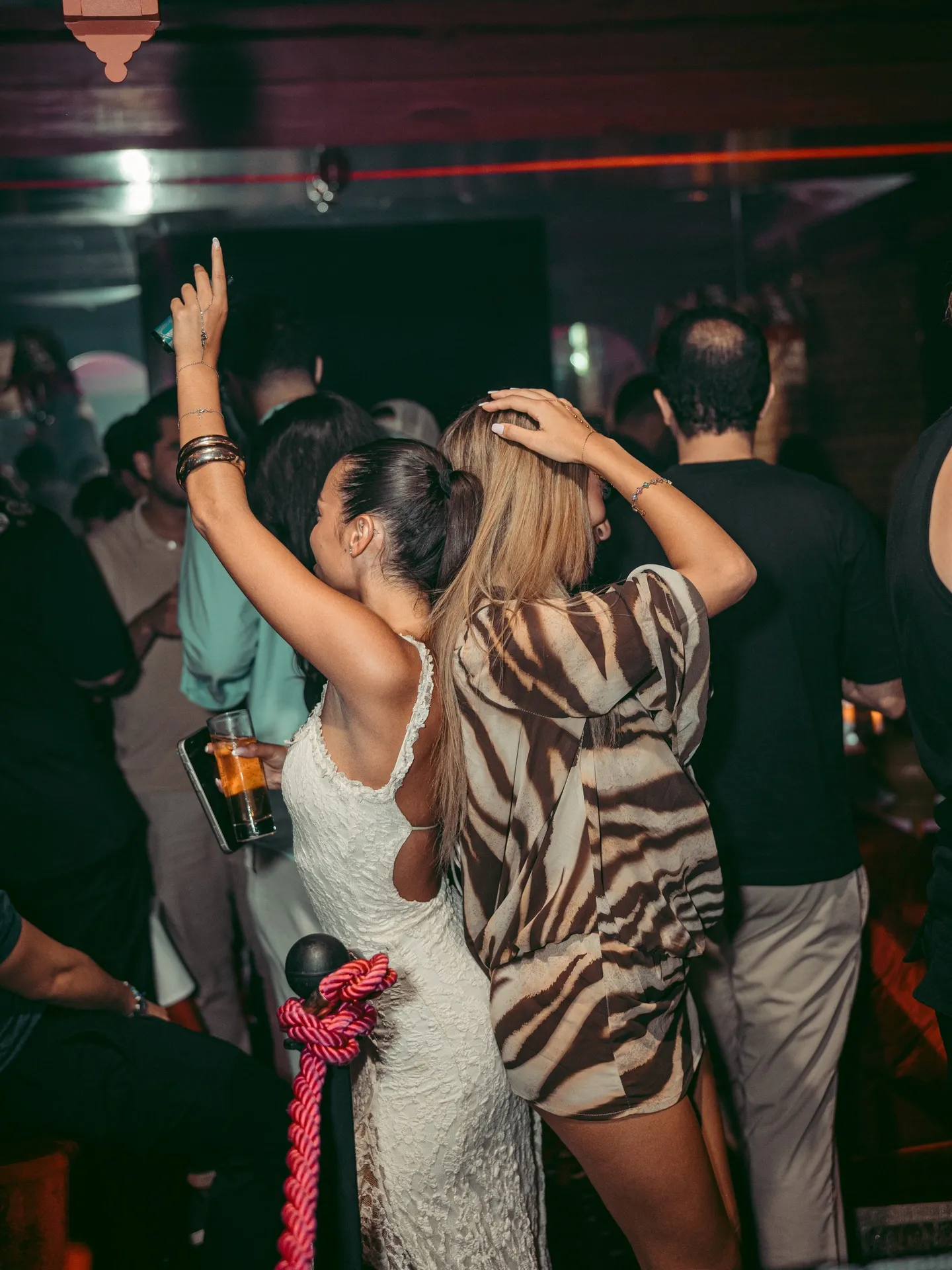 Guests dancing under the lights at The Club Agadir