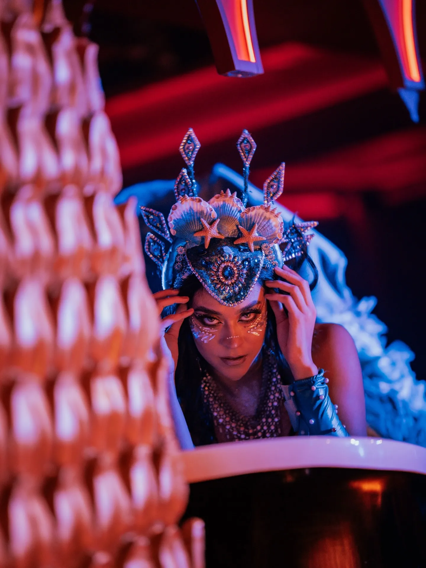 A performer in a feathered headdress at The Club Agadir